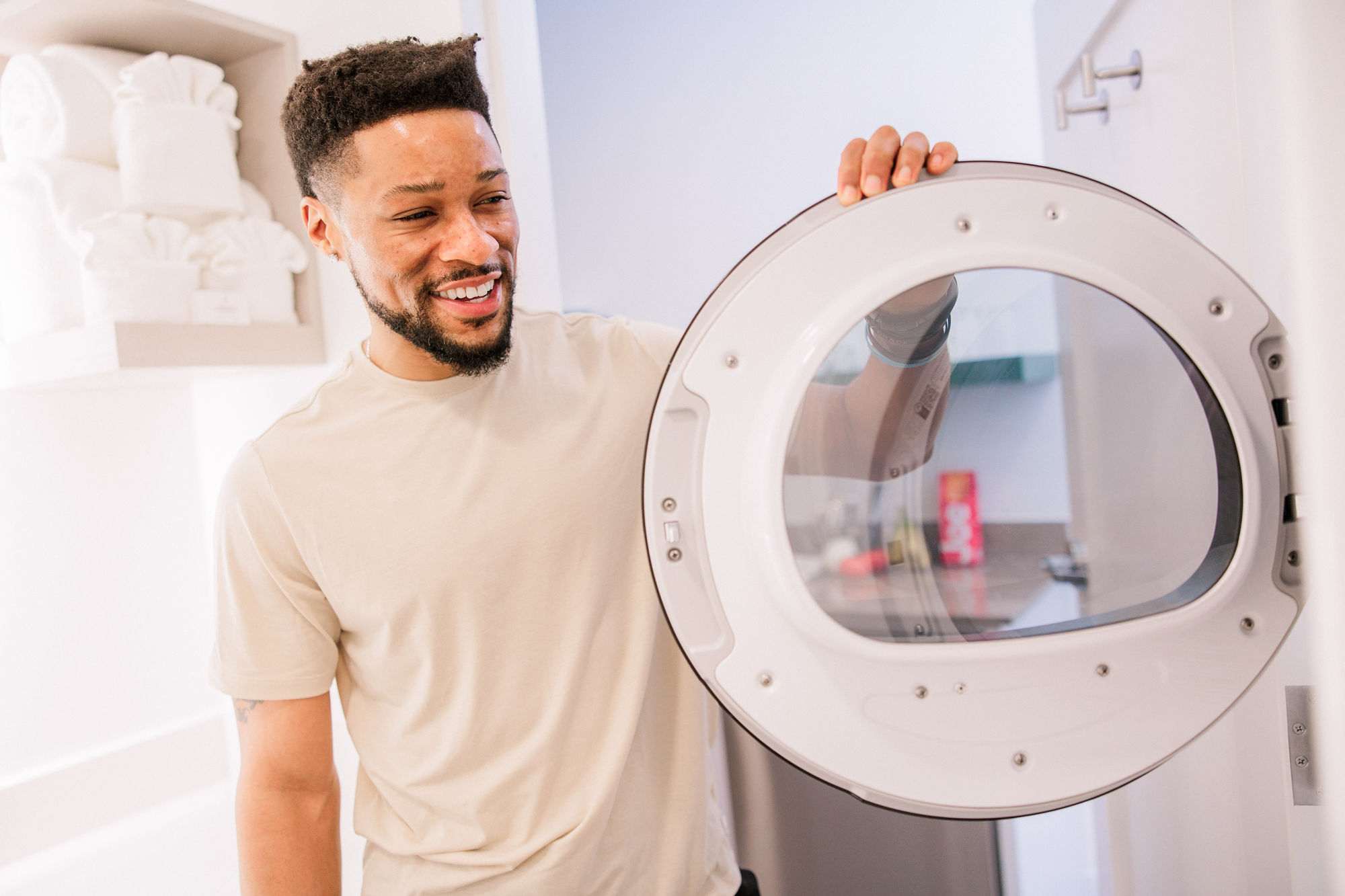 Modern extended-stay hotel bathroom with in-suite washer and dryer at YourSpace Hotels Chesapeake, designed for comfort and independence.
