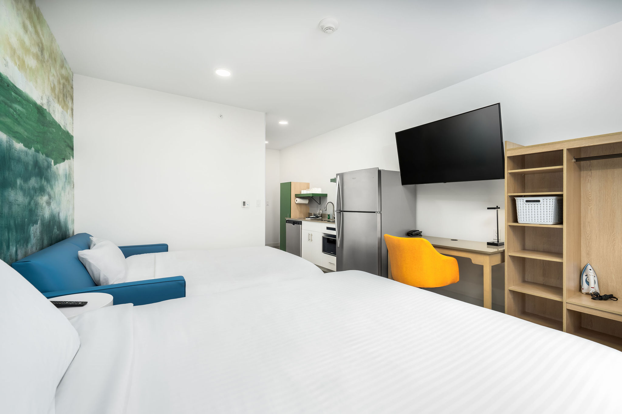 Detailed floor plan of a modern double-queen suite at YourSpace Hotels Chesapeake, showcasing open layouts and extended-stay functionality.