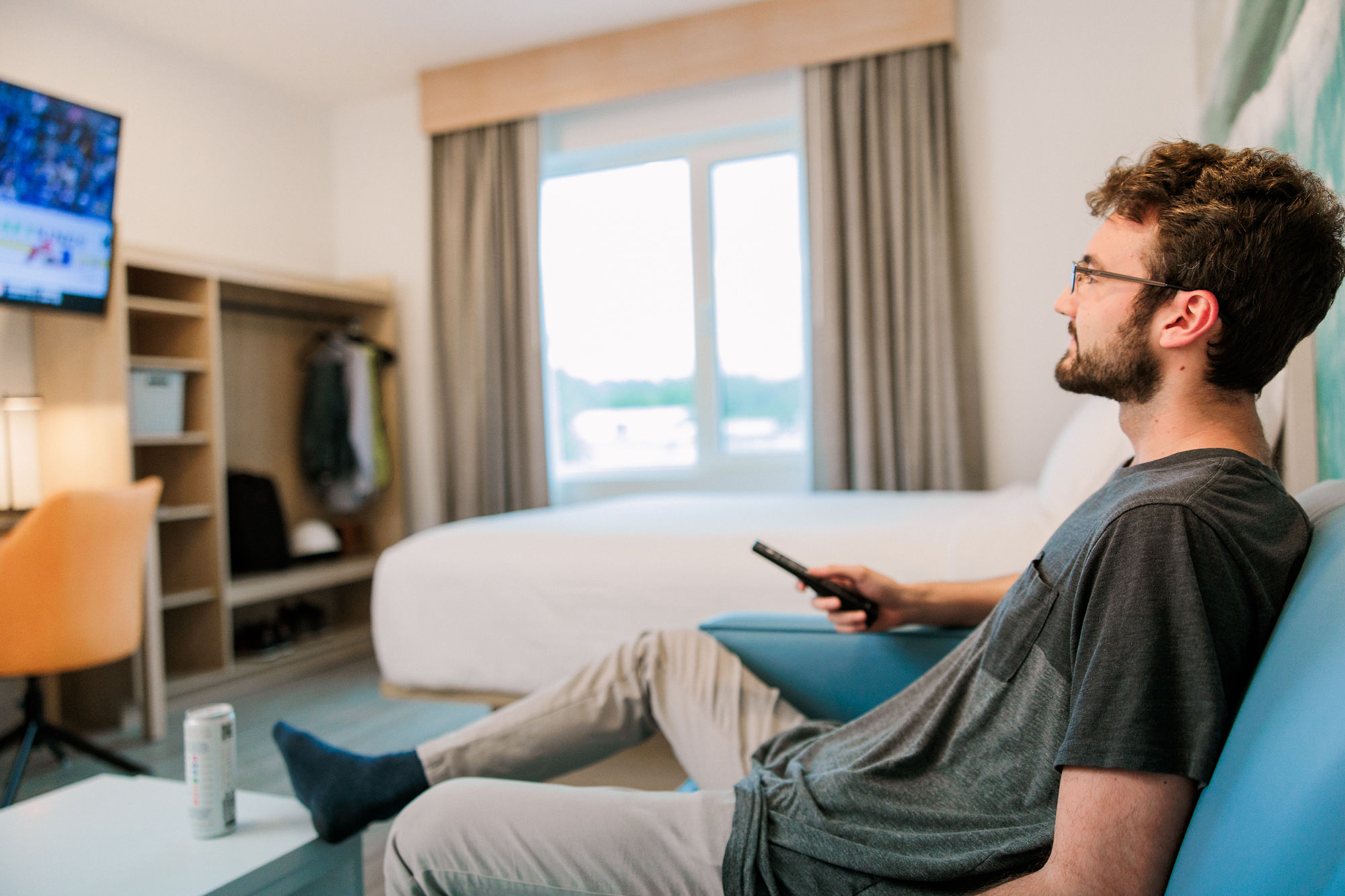 Cozy living room with kitchen and dining area at YourSpace Hotels Chesapeake extended-stay hotel.