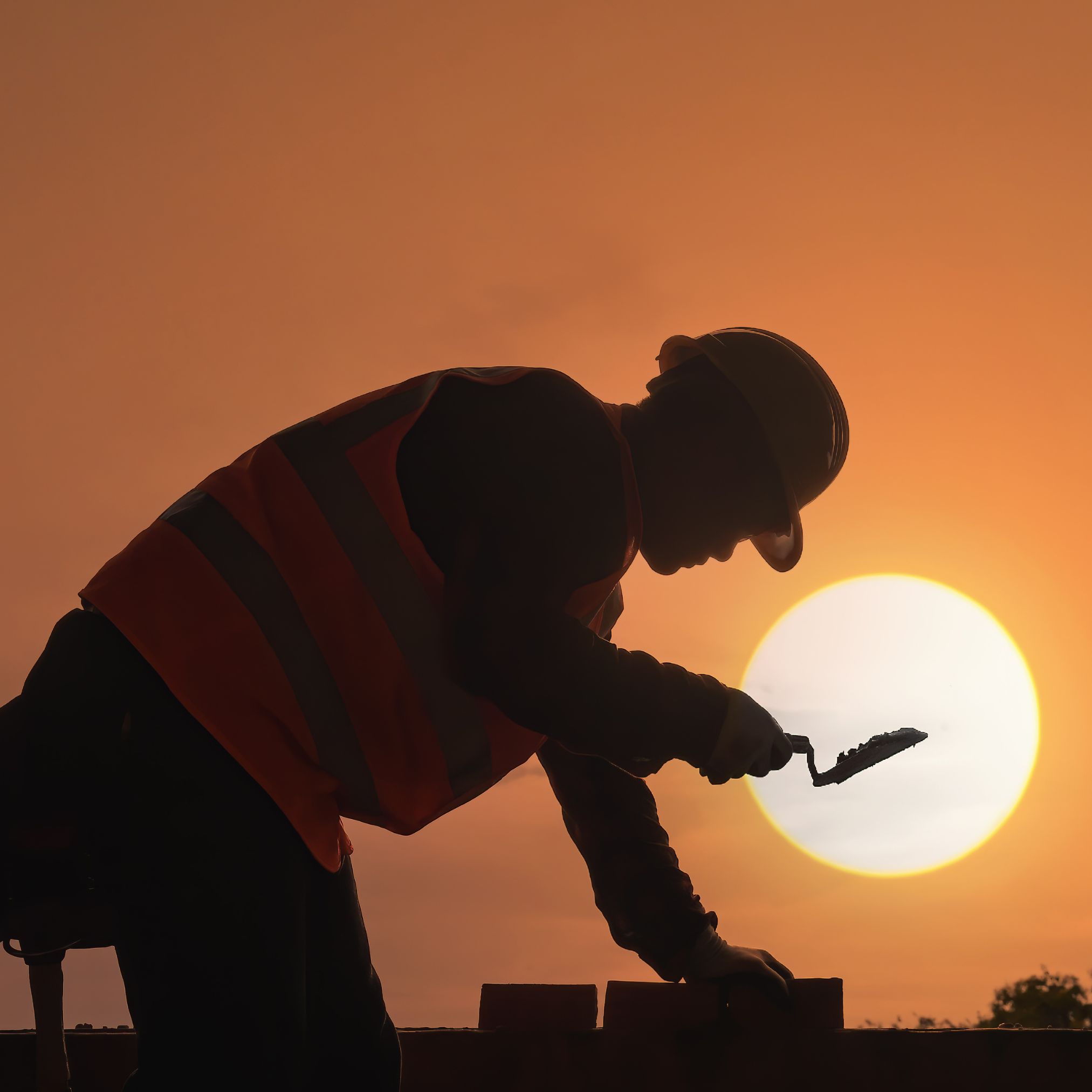 Extended-stay hotel for construction workers in Chesapeake, VA. Construction worker relaxing after a shift at YourSpace Hotels Chesapeake extended-stay suites.